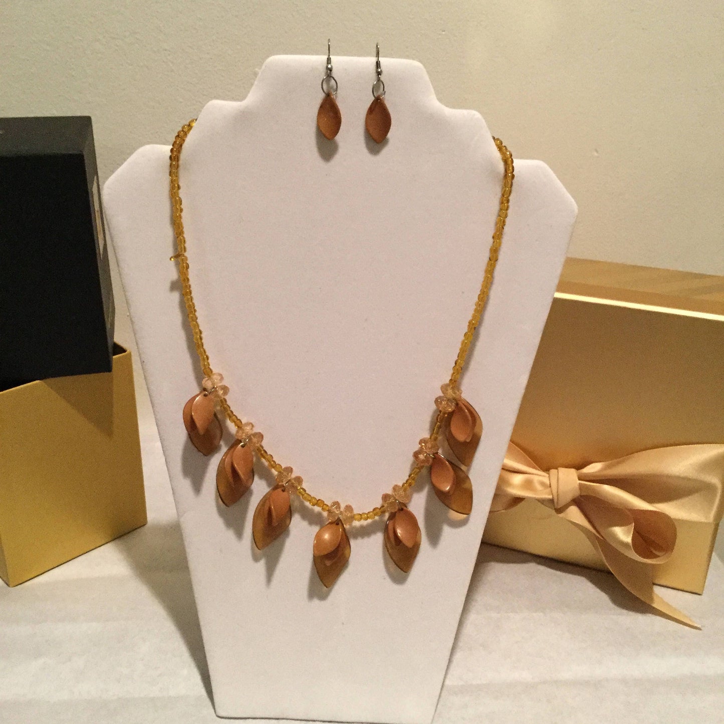 Med Tan, Light Gold Petal Necklace w/Earrings.