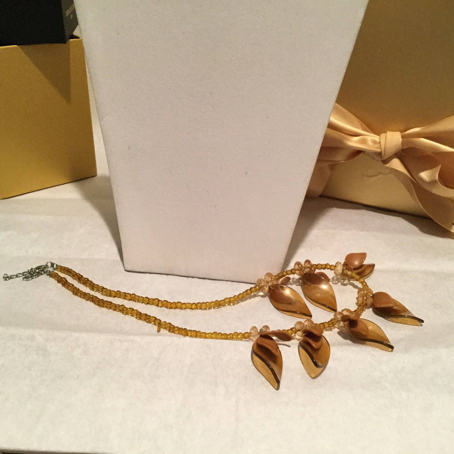 Med Tan, Light Gold Petal Necklace w/Earrings.