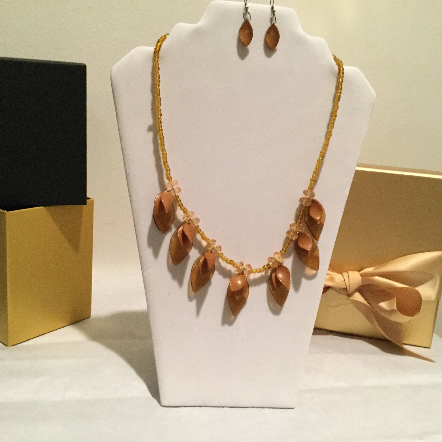 Med Tan, Light Gold Petal Necklace w/Earrings.