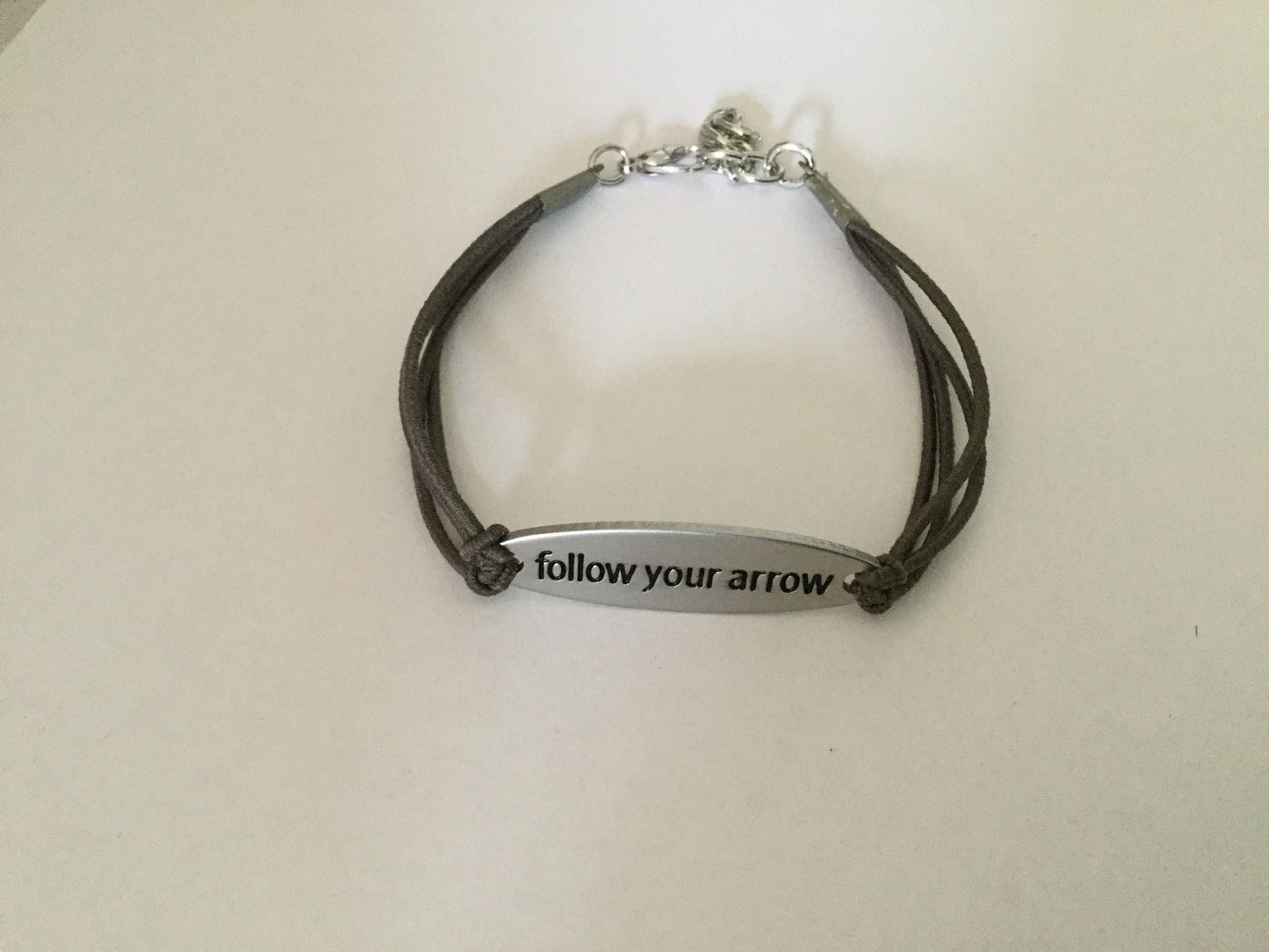 Follow Your Arrow, Silver Metal Inspirational Quoted Bracelet.